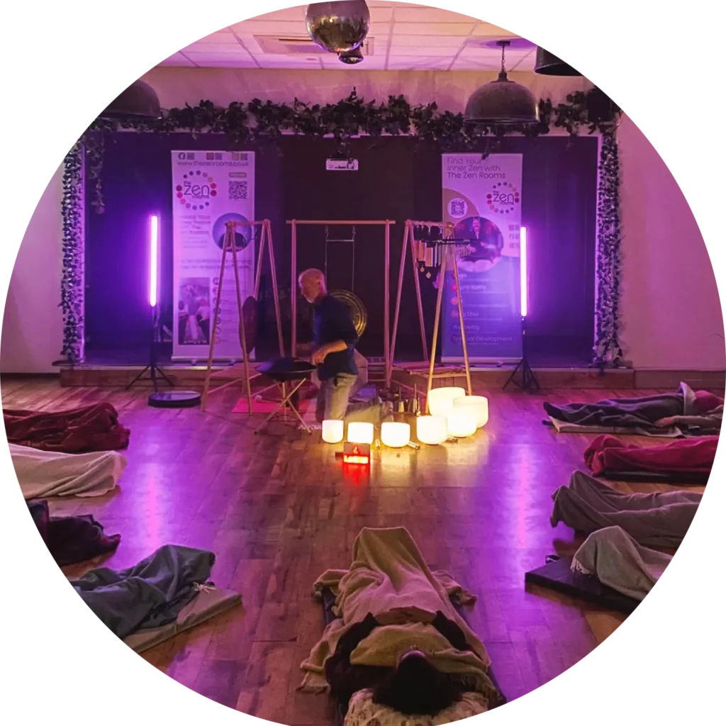 From Good Intentions to Community-Led Wellbeing Projects Participants resting on mats during a community sound healing session led by Neil Perry-Timson.